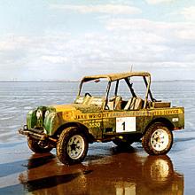 Series one land Rover on the beach