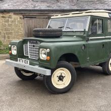 The land Rover Series 3 can be seen with spare wheel on the bonnet