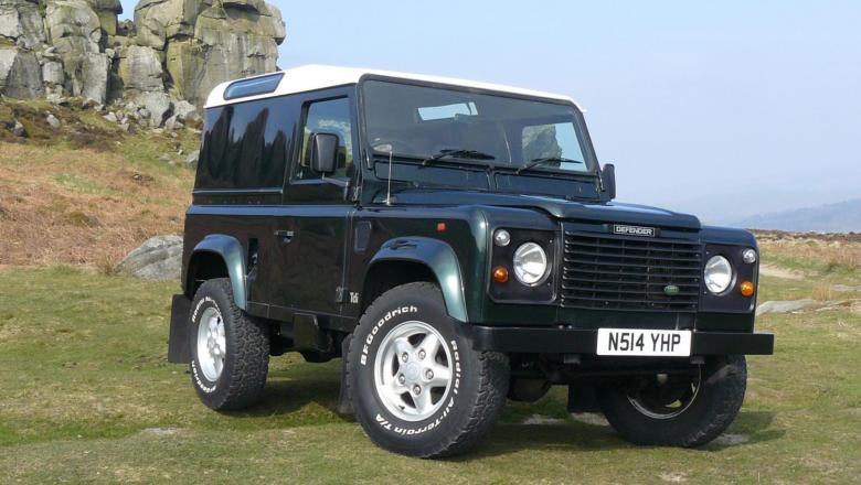 A very nice Land Rover 90 is seen near the Cow and calf rocks on Ilkley moors in Yorkshire .