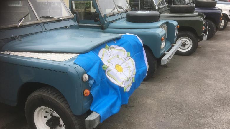 Yorkshire flag is on the front of a land rover series 3 in our yard celebrating 2021