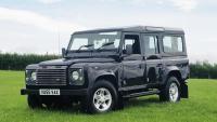 land rover 110 standing in a nice field